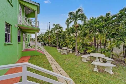 Best E Villas property beside a landscaped tropical garden
