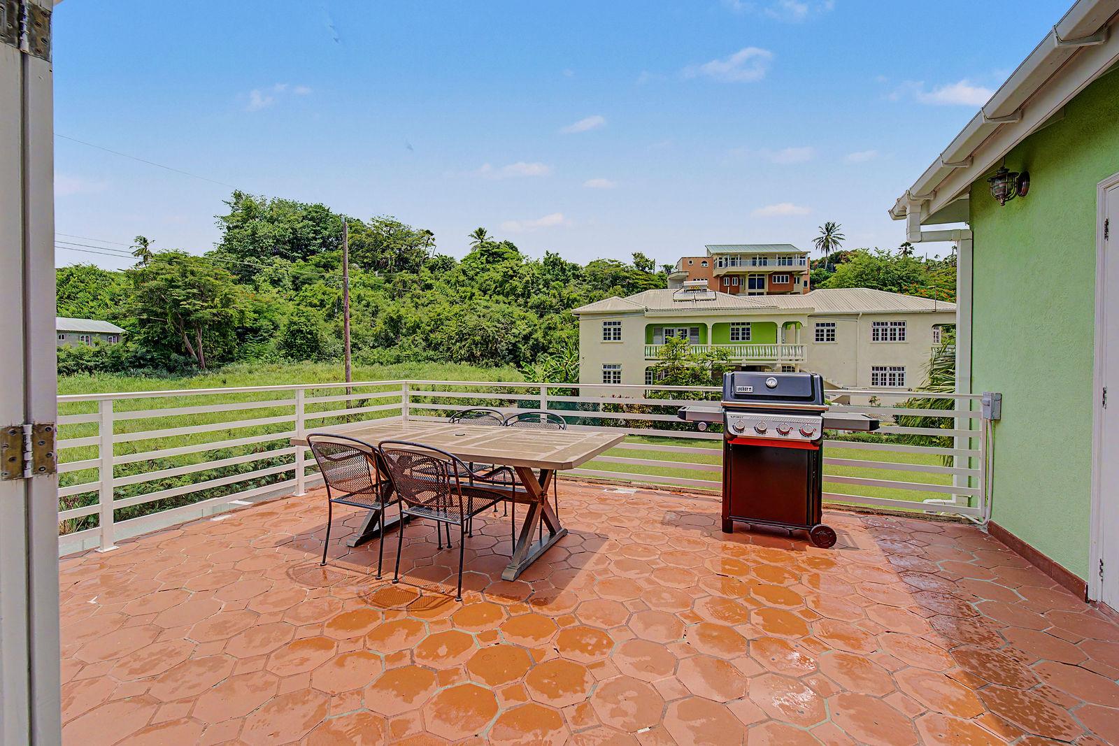 Outdoor dining terrace at a Best E Villas apartment in Prospect