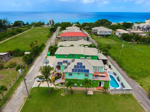 Aerial view of the Prospect villas and shared pool near the Caribbean Sea