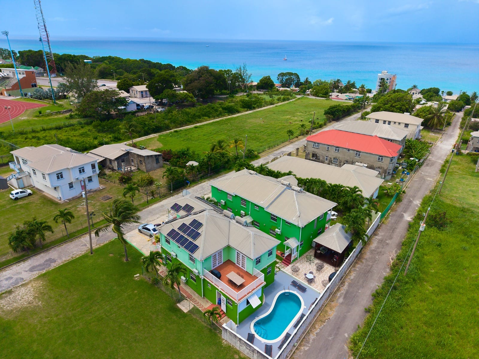 Aerial view of the Prospect villas, shared pool and nearby Caribbean Sea