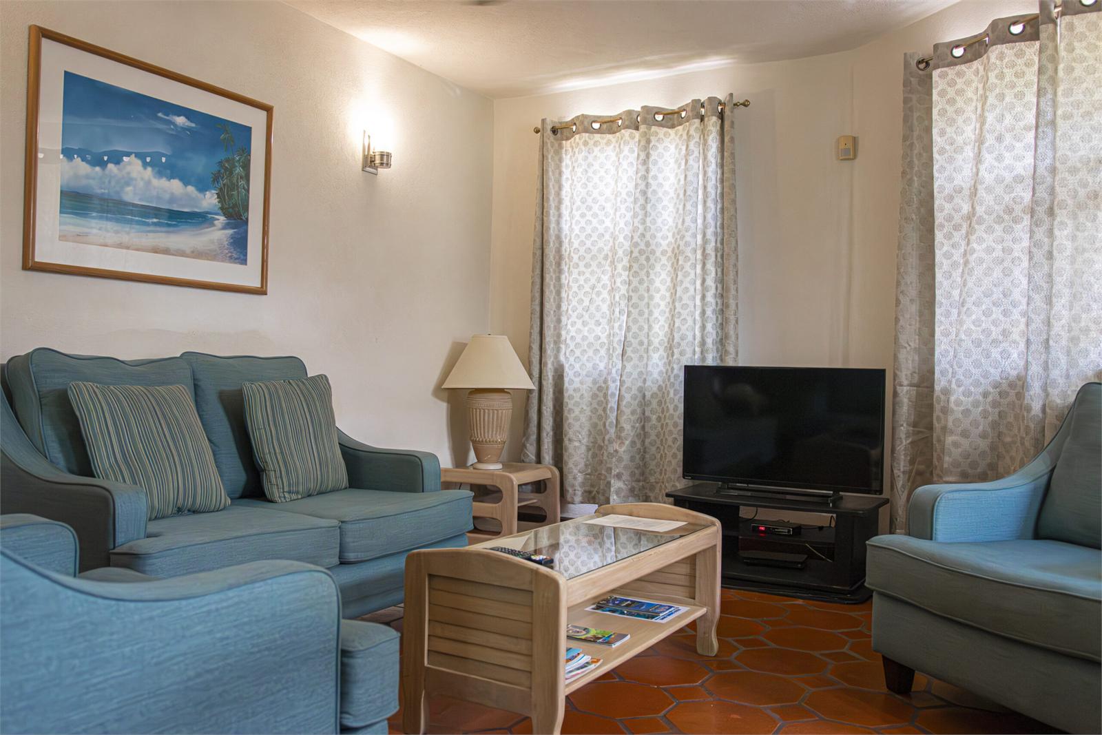 Blue-sofa living area in the two-bedroom Prospect villa