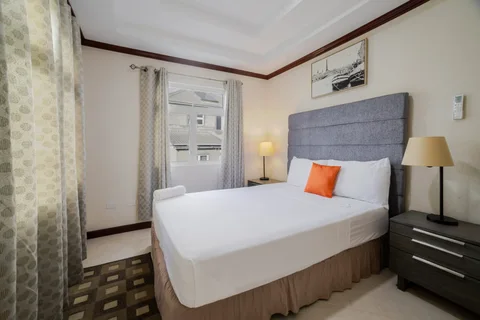 Bedroom with orange cushion at the St. Silas villa