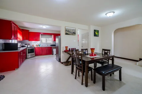 Dining area beside the red kitchen at St. Silas