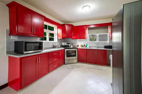 Red fitted kitchen at the St. Silas villa