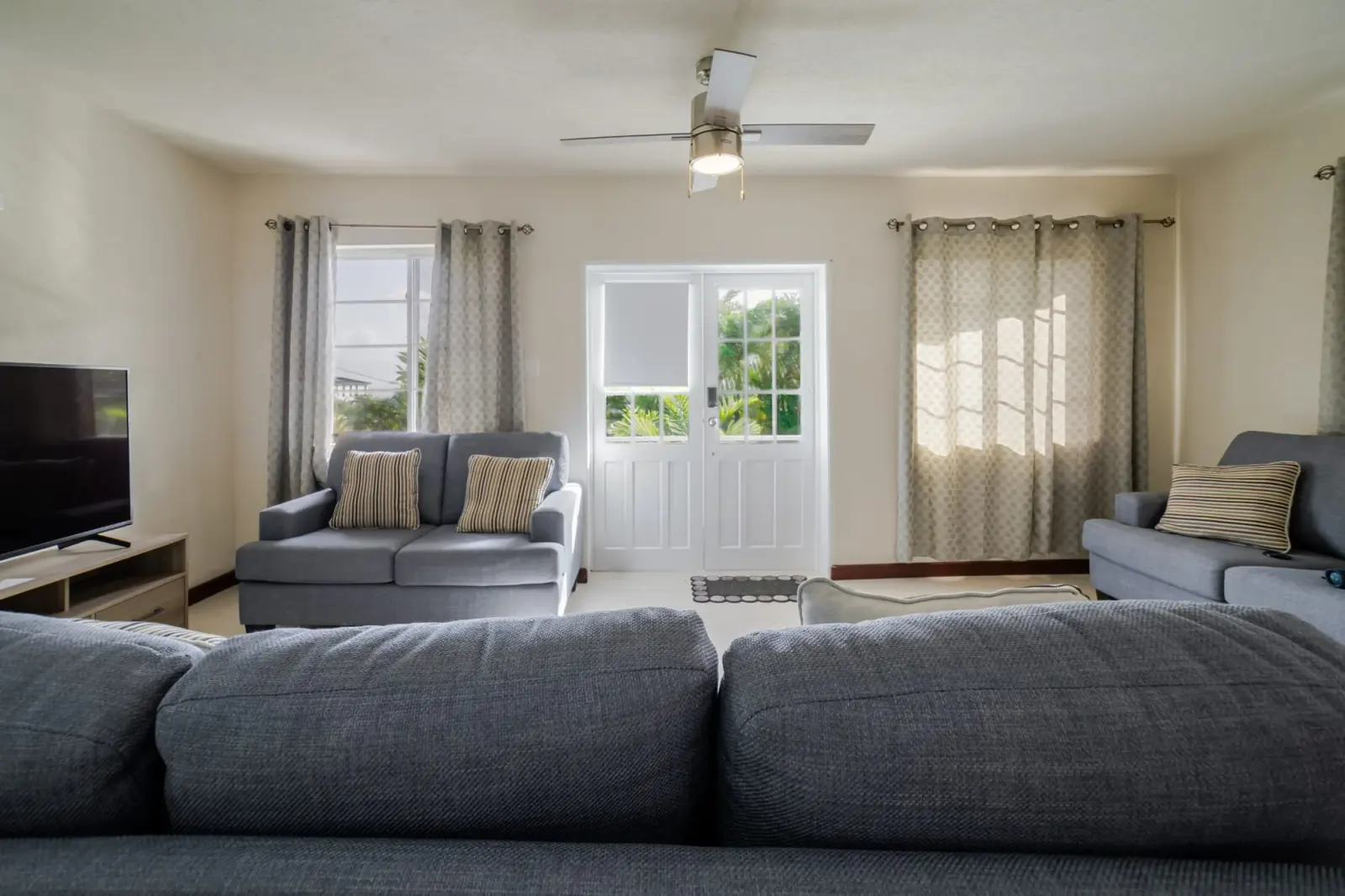Alternate living-room view with sofas and French doors at St. Silas